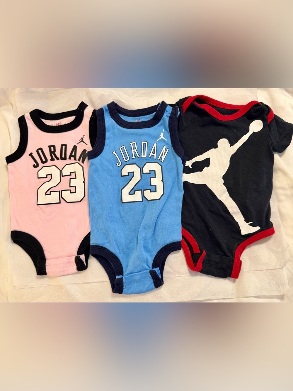3 Jordan onesies. 6mos & 12mos. Snap crotch.